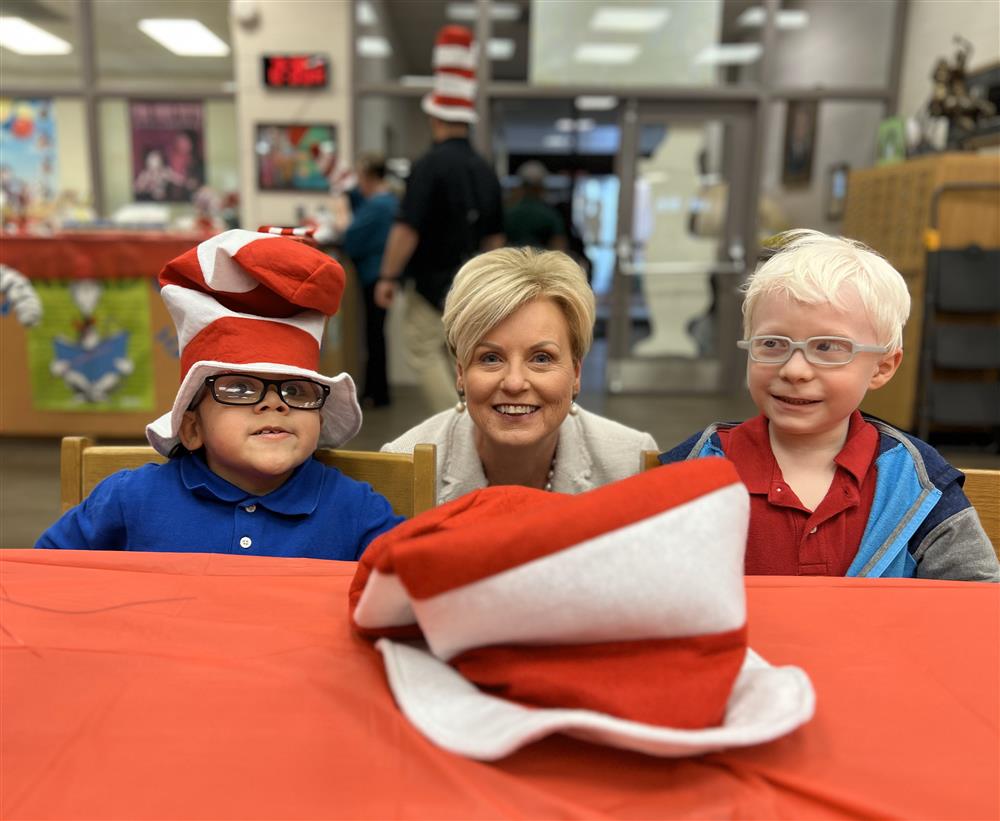 Asher Cobb and Landon Valensica posting with OIA Executive Director, Becky Watson